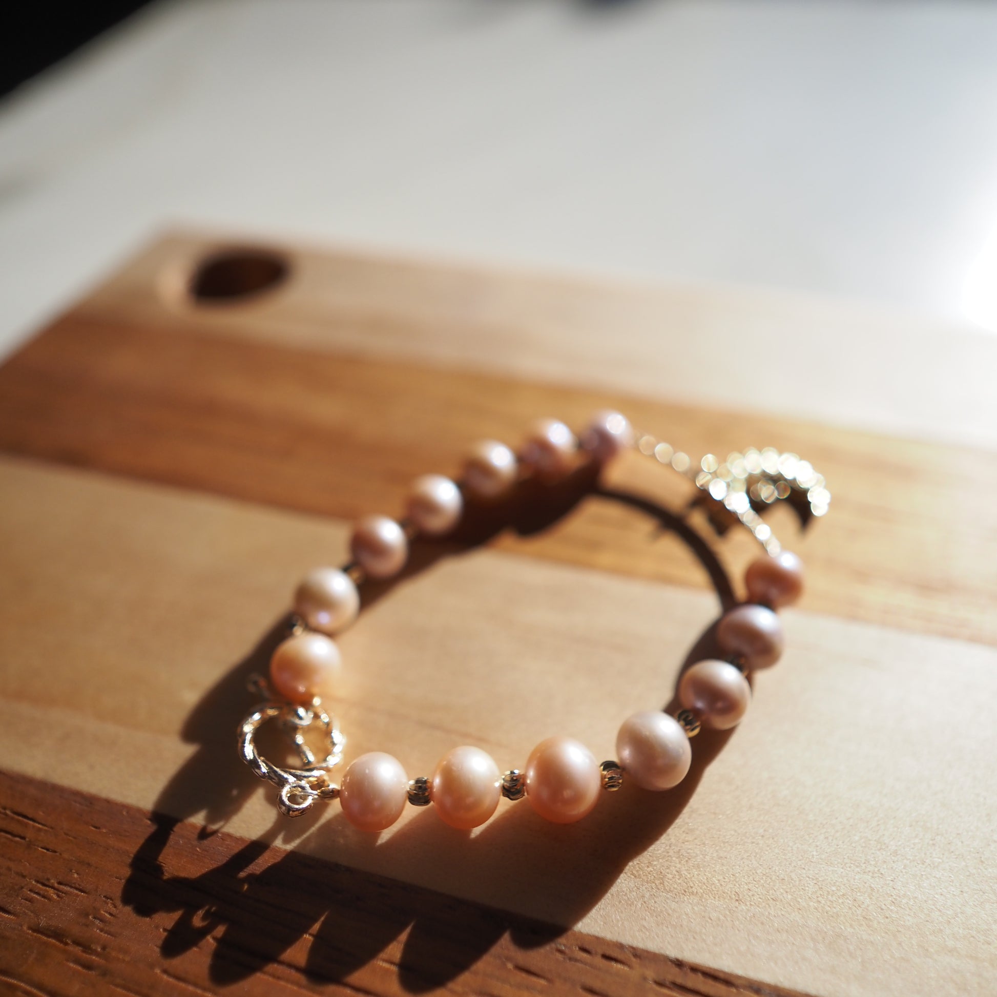 Natural Pinky Orange High Luster Round Bead Freshwater Pearls Bracelet, Gold Plated Zennara
